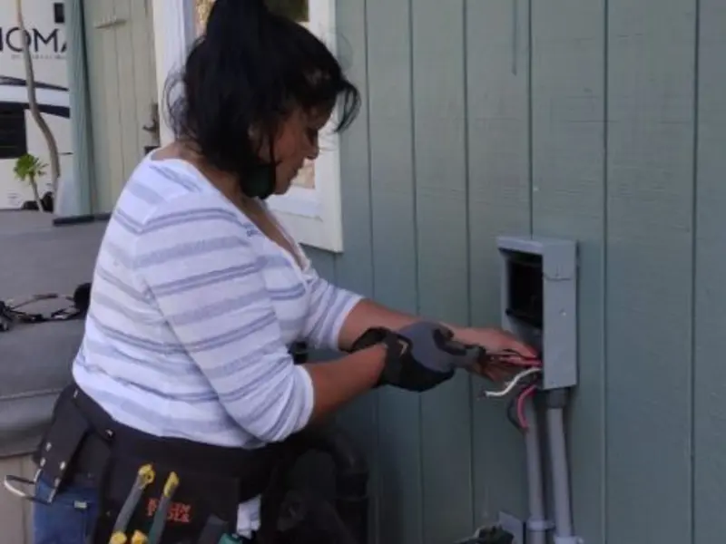 Licensed electrician wiring an exterior subpanel in Parowan
