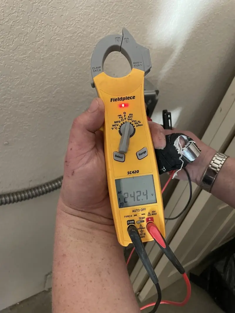 Voltage testing with clamp meter during Outlet Installation in Parowan